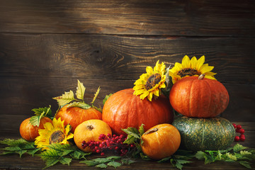 Happy Thanksgiving Day background, wooden table, decorated with vegetables, fruits and autumn leaves. Autumn background.