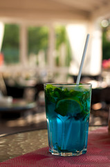 Tradition Summer drink blue mojito with lime mint and ice.