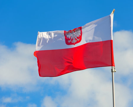 Polish flag with emblem of white eagle.