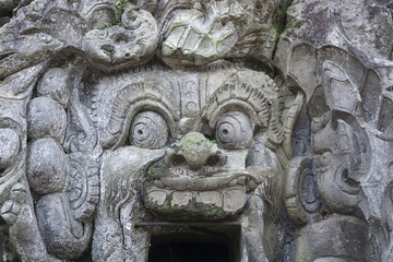 Fototapeta na wymiar Stone Spirit at entrance of Goa Gajah Cave, Ubud, Bali Indonesia