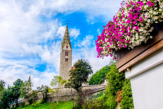 Villandro (Villander) - Trentino Alto Adige - Sudtirolo - Italy - colorful summer bell tower flowers on balcony