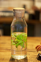 fruit water with peppermint in glass bottle