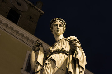 Sculpture in a square in Rome at night - Piazza del Popolo. Italy