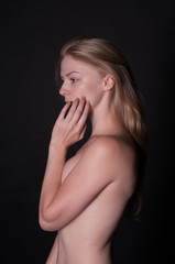 Studio portrait of young blonde woman - natural pure skin, no make up