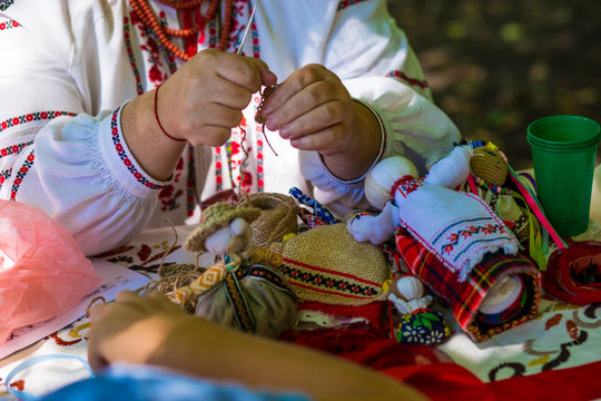Doll is made of fabric. Sewn doll in a traditional costume, handmade. Doll motanka. Russian tradition the hand-made. A toy from fabric. - Powered by Adobe