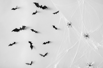 halloween decoration of bats and spiders on web