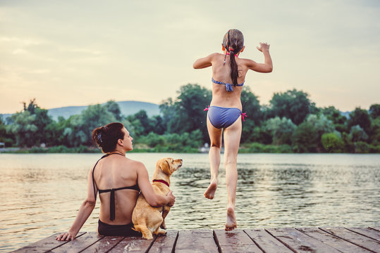 Girl Jumping Into Water