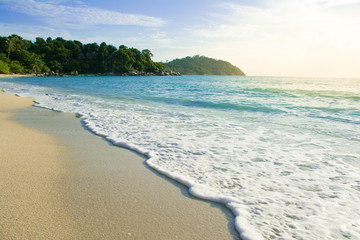 Beautiful seascape wtih blue sky and orange sunlight