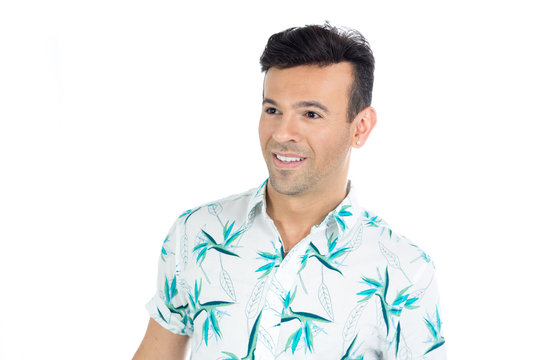 Smiling man looks to the side. Portrait. Handsome brazilian male wears summer clothes..