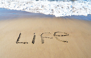 The word life on the beach background