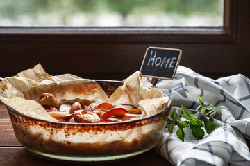 pie with plums near a window