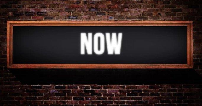 Now sign / on air wooden concept on a brick wall