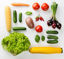Different tasty fresh vegetables on White Backrgound Top View