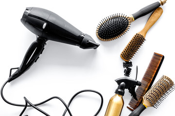 Combs and hairdresser tools in beauty salon on white background top view copyspace