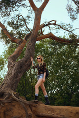 Fototapeta premium Pretty hiker is looking for a trail