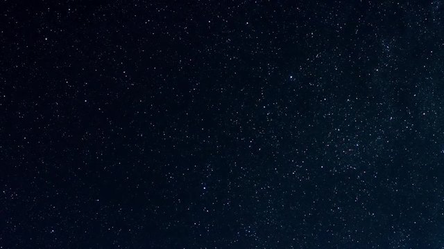clear night sky full of stars with flying satelites, airplains and Perseids meteor shower, timelapse