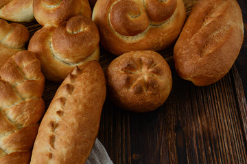 Homemade bread on a wooden background.