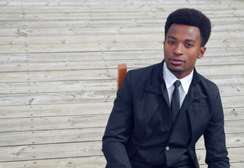 young businessman sitting high angle view wood