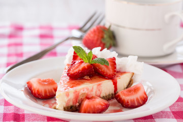 Cheesecake Slice With Fresh Cut Strawberries and Coffee Cup