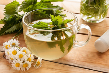 Freshly prepared nettle tea on a wooden table