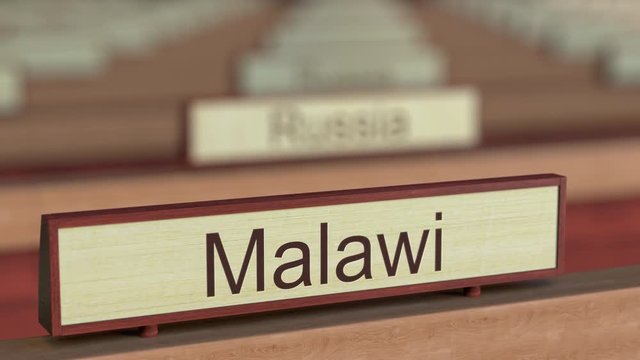 Malawi name sign among different countries plaques at international organization. 3D rendering
