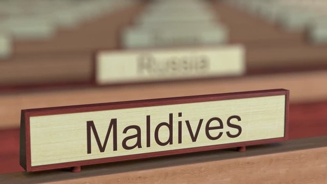 Maldives name sign among different countries plaques at international organization. 3D rendering