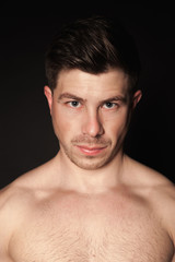 Obraz premium Portrait of sporty man. Caucasian male model in studio shoot.