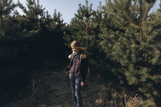 Woman standing in forest