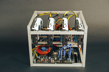 System for the crypto currency. Video cards in the folded box. Farm on a black background