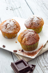 Muffins on a wooden table