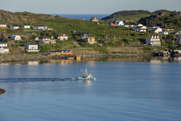 Fototapeta na wymiar fishing boat leaving Twillingate harbor; Newfoundland