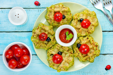 Funny snack waffles with cherry tomatoes ladybugs