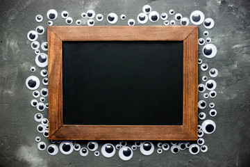 Eyeball frame with blank chalkboard for text