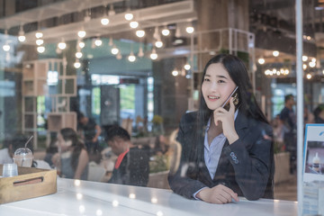 Beauty business  woman in sunglasses talking on the smartphone