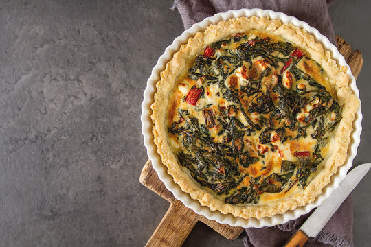 Homemade cheese Quiche egg for brunch with spinach and chard