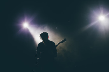Guitarist silhouette on a stage