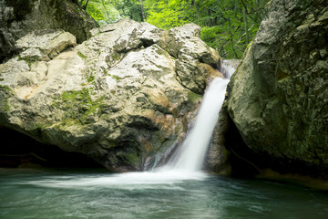Fototapeta na wymiar Waterfall on a Mountain River of Crimea