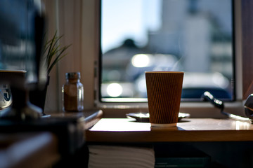 A glass of latte in the coffee house to go