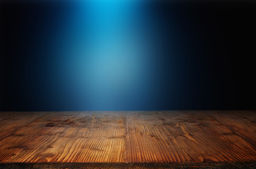Wooden table with blue light beam
