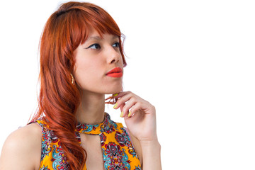 Naklejka premium Girl evaluating a possibility. Hand on chin. Young redhead woman with summer dress..