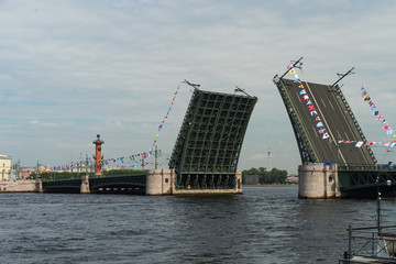 Fototapeta na wymiar Open bridge in Saint-Petersburg in Russia during daytime. Impossible to pass