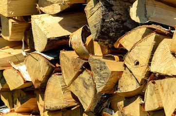 Stacked Logs Texture, Natural Background. Cross section of the timber, firewood stack for the background