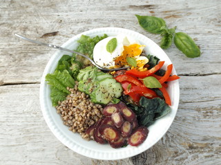 




Bowl of Buddha. The concept of healthy vegetarian food. Boiled buckwheat, cabbage kale, egg poached and raw vegetables