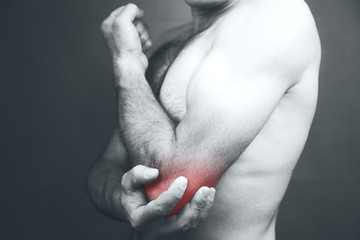 young man having pain in his elbow