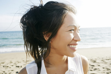 Portrait of Vietnamese woman at beach smiling