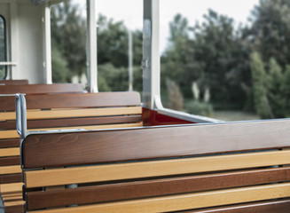 Old style wooden seats inside passenger train
