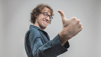 Fototapeta premium successful man portrait with a thumb up