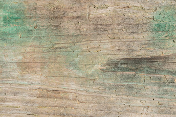 Dark texture of old natural wood with cracks from exposure to sun and wind