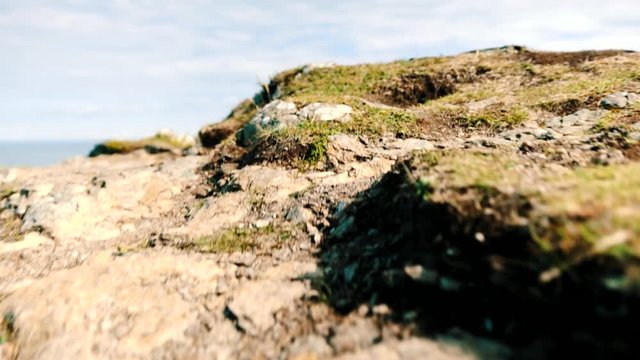 Low Prospective of a Man Hiking in Hothw Traking. Ireland Landscape