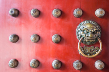 Chinatown traditional red wooden door guardian brass handle